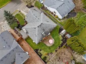 This bird’s eye view gives you a great sense of how thoughtfully the property is arranged. You can clearly see the fenced backyard wrapping the home, with convenient gates on both sides for easy access, perfect for moving gear, corralling furry friends, or simply enjoying the flow of the yard. The 1,588 square foot footprint feels efficient and well planned, and having a sprinkler system servicing both the front and back lawns means curb appeal and backyard hangouts stay fresh without constant babysitting. It is tidy, practical, and ready for whatever pace of life the next owner brings.