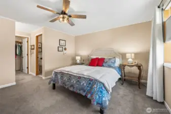 From the window side, you really get a sense of how well this primary suite is laid out. The sightline runs cleanly across the room to the walk-in closet and attached bath, which makes everyday routines feel organized and intuitive. Soft neutral tones keep the space feeling calm and flexible for any furniture style, while the generous proportions give you options to spread out instead of squeezing everything against the walls. It is the kind of bedroom that quietly supports real life, morning coffee moments, getting ready without bumping elbows, and an easy wind down at the end of the day.