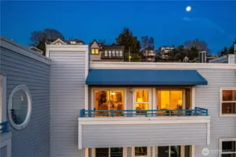 Top-floor positioning enhances privacy and quiet while capturing more natural light and a broader sweep of water and sky