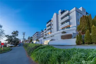 Pull in, park in your secured garage space, and take the nearby elevator up, arriving just steps from your top-floor front door