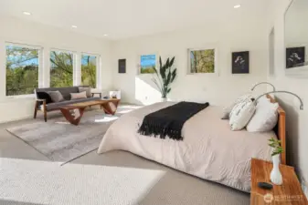 The primary bedroom boasts a full bath, walk in closet, and a comfortable living space.