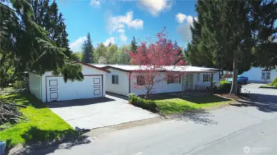 Welcome to Kenton Firs -- you own the land and the home...and this is the only home with a 2-car garage in the community!