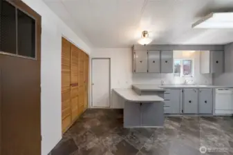 The door in the background leads to a covered patio--perfect for grilling and dining outside...or just relaxing! Laundry closet on the left, and the forced-air furnace is situated in the closet on the left foreground.