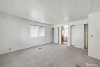 Plenty of space in the Primary Bedroom! It also features two closets with built-in shelving and a Primary Bathroom.