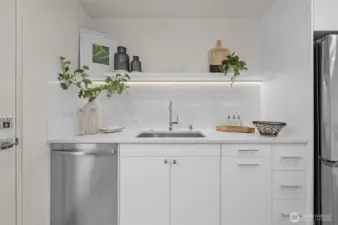 Minimalist magic—your sink space has a glow-up—room for your essentials, plus a little flair with floating shelving and fresh accents.