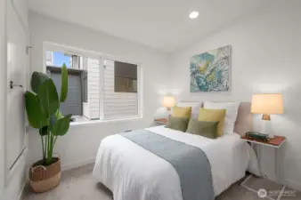 The second bedroom offers privacy and comfort, which is ideal for guests or a stylish home office setup.