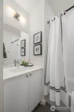Photos of model home with similar finishes & floor plan. Crisp, modern bath with polished finishes, extra storage, and a full tub—your everyday routine just got an upgrade.