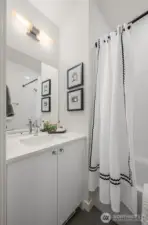 Crisp, modern bath with polished finishes, extra storage, and a full tub—your everyday routine just got an upgrade.