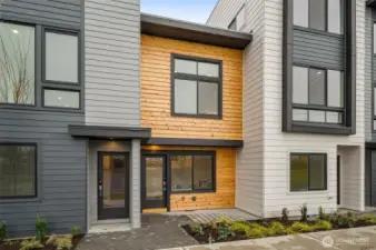 That golden hour glow hits differently when it’s bouncing off designer wood siding like this. This isn’t just a front door—it’s your new favorite place to come home to.
