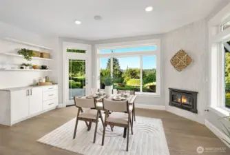Dining nook off the kitchen that has doors to the expansive patio.
