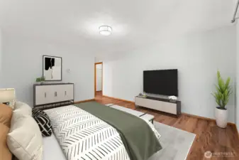 Spacious primary bedroom with private bath and walk-in closet.
