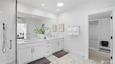 Dual sink vanity with modern finishes. Heated tile floors for comfort year-round.