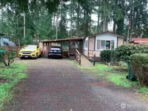 Welcome home to this spacious 3-bedroom, 1.5-bath residence with covered carport and aluminum roof, set on a fenced lot in a conveniently located all-ages park near shopping, dining, and local amenities.