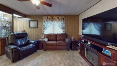 The home features an open floor plan the large living room opening to the dining area and kitchen.