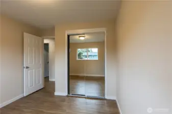 Upstairs bedroom #2. Mirrored closet doors.