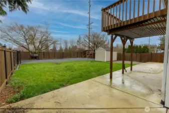 Backyard showing deck. Fully fenced. RV parking with power. Shed with power. Large patio.