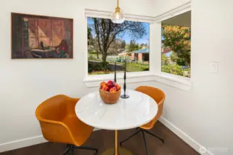 This eating nook overlooks the front yard - and Lawton Elementary + playground right across the street!