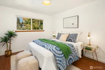 The second of two bedrooms is also located at the end of the hallway.