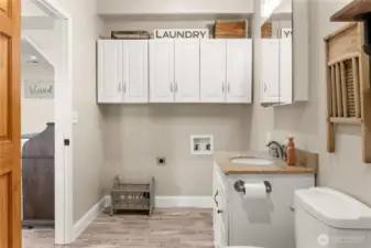 Downstairs bathroom with laundry space