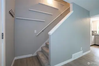 Ascend the stairs to access the 4 bedrooms and full bath.