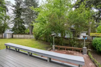 Adjacent to the rear deck, offering a view of the backyard.