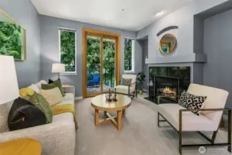 Lovely living room with outlooks of trees; very peaceful.