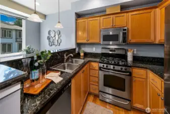 Kitchen has plenty of counterspace, gas cooking, and lots of storage.