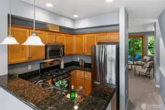 Kitchen has plenty of counterspace, gas cooking, and lots of storage.