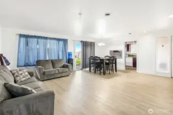 The living area is open, spacious, and clean!