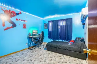 Well lit and spacious, this second bedroom is perfect for a bedroom, office, or craft room. It faces the backyard.