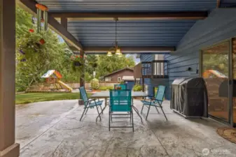 This will be a favorite! Covered patio with stamped concrete!