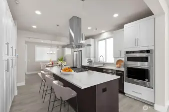 Virtual staging. Thick slab quartz countertops, 5 burner gas range, two tone cabinetry w/soft close cabinets and full height tile backsplash.