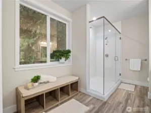 Double showers make getting ready fast and efficient. Plumbing for a bath tup exists underneath the bench should you want to put one in.