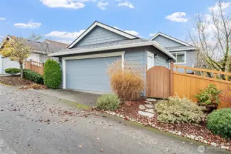 The detached garage offers convenience and flexibility, featuring a man door that leads directly into your private backyard for easy access.