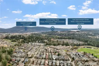 This stunning aerial view highlights the home’s ideal location, surrounded by natural beauty and close to everyday conveniences. Nearby amenities include Swedish Hospital (2.2 miles), Grand Ridge Plaza with shops, restaurants, and cafés (1.6 miles), and the Lake Sammamish Center for additional retail and dining options (3.0 miles)—all just moments from your doorstep.