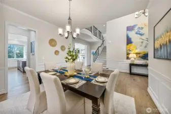 Formal dining is open to foyer.