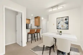 Dining Area flowing into the eat-in kitchen *this photo is virtually staged*