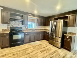 A gourmet kitchen with an enormous LG refrigerator and freezer.