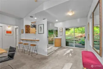 Breakfast nook space off kitchen with slider to deck and trails