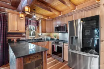 Kitchen w/ SS appliances, granite counters, hickory counters