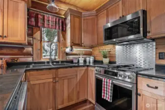 Kitchen w/ SS appliances, granite counters, hickory counters