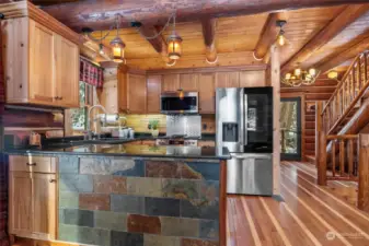 Kitchen w/ SS appliances, granite counters, hickory counters