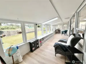 Large Light and Bright Sunroom looking out onto the golf course