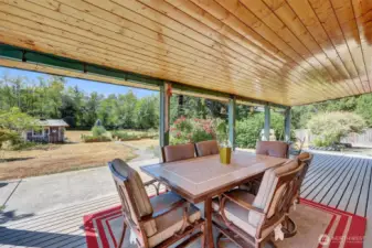 Covered deck overlooks the back part of the property.