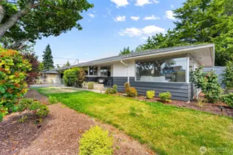 Mature landscaping surrounds the home—beautiful and low-maintenance.
