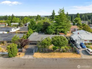 Fully fenced property with gated entry offers room to park an RV or multiple vehicles—rare in Tacoma!