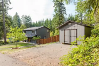Ample parking and great curb appeal with detached shed for storage.