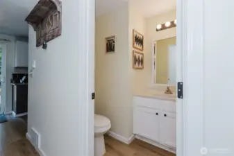 Half bath with modern fixtures.