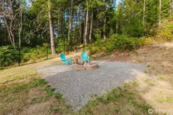 Outdoor sitting area surrounded by greenery.