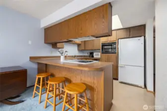 Kitchen opens to dining area